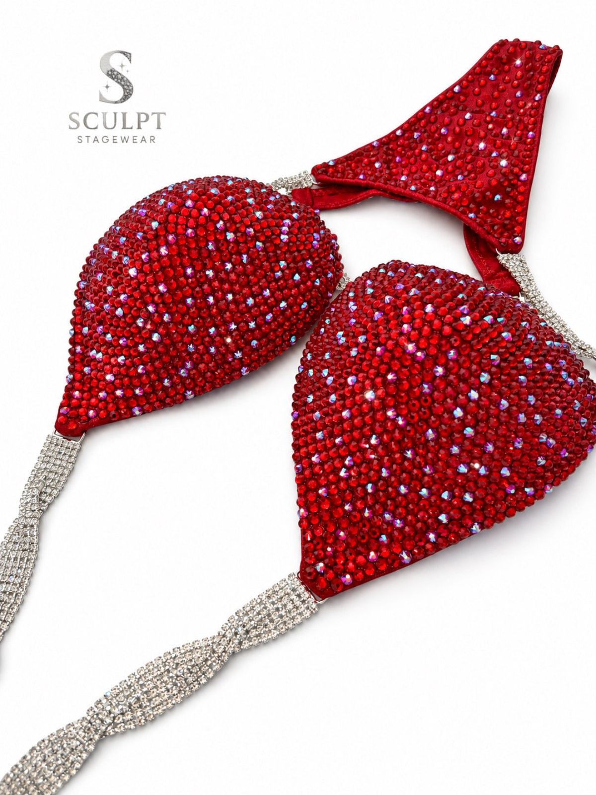 Competitor on stage wearing a bespoke Sculpt Stagewear rhinestone bikini